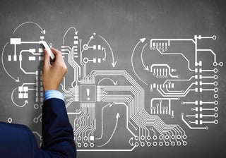 Close up image human hand drawing circuit board.jpeg