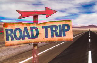 Road Trip sign with road background.jpeg