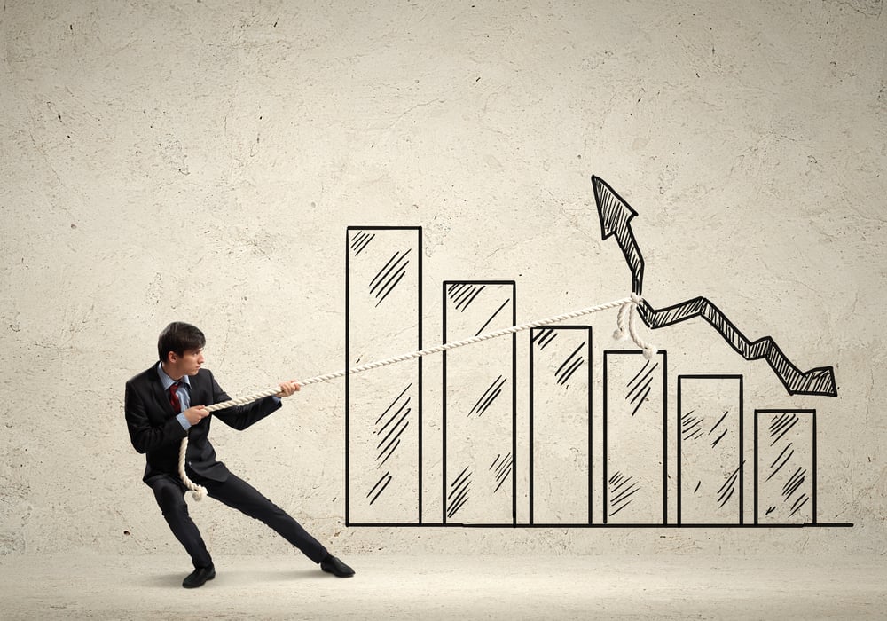 Image of young businessman pulling graph. Chart growth concept